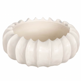 A beige scalloped carved wooden bowl on a white background.