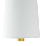 Brass and alabaster wall sconce with white shade on white wall.