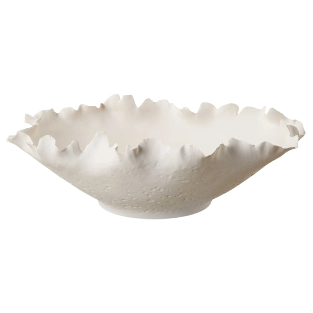 A matte off-white ceramic bowl with delicately crafted, organic edges on a white background.