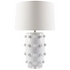 Table lamp with textured white base and gray shade on a white background
