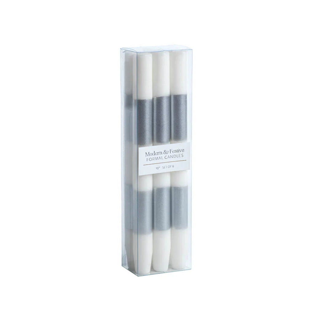 Set of four white candles in a clear packaging box on a white background