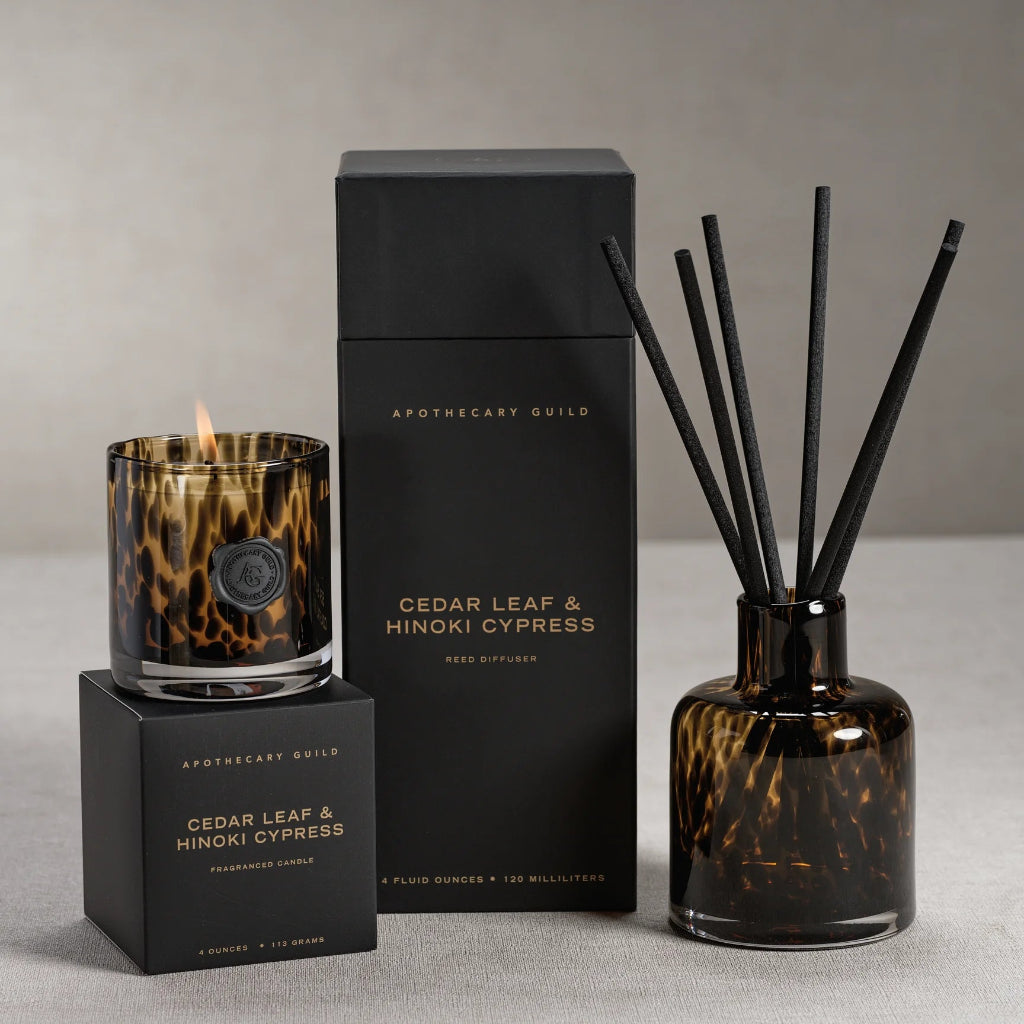 Apothecary Guild Cedar Leaf & Hinoki Cypress candle, diffuser, and packaging on a neutral background