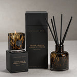 Apothecary Guild Cedar Leaf & Hinoki Cypress candle, diffuser, and packaging on a neutral background
