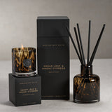 Apothecary Guild Cedar Leaf & Hinoki Cypress candle, diffuser, and packaging on a neutral background