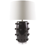 Black lamp with textured design and white shade on a white background
