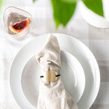 Avery Napkin styled with  classic white dinnerware