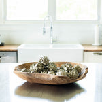 Hand Carved Teak Wood Bowl filled with artichokes