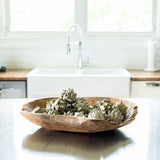 Hand Carved Teak Wood Bowl filled with artichokes