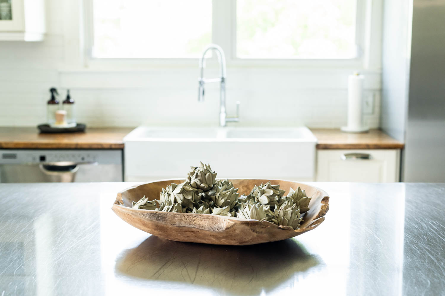 Hand Carved Teak Wood Bowl filled with artichokes