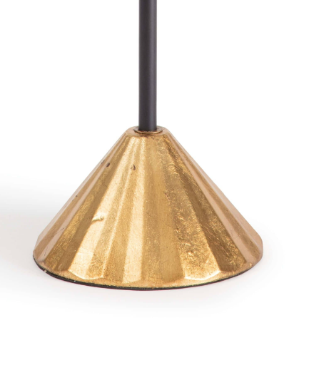 Gold and black lamp with white background.