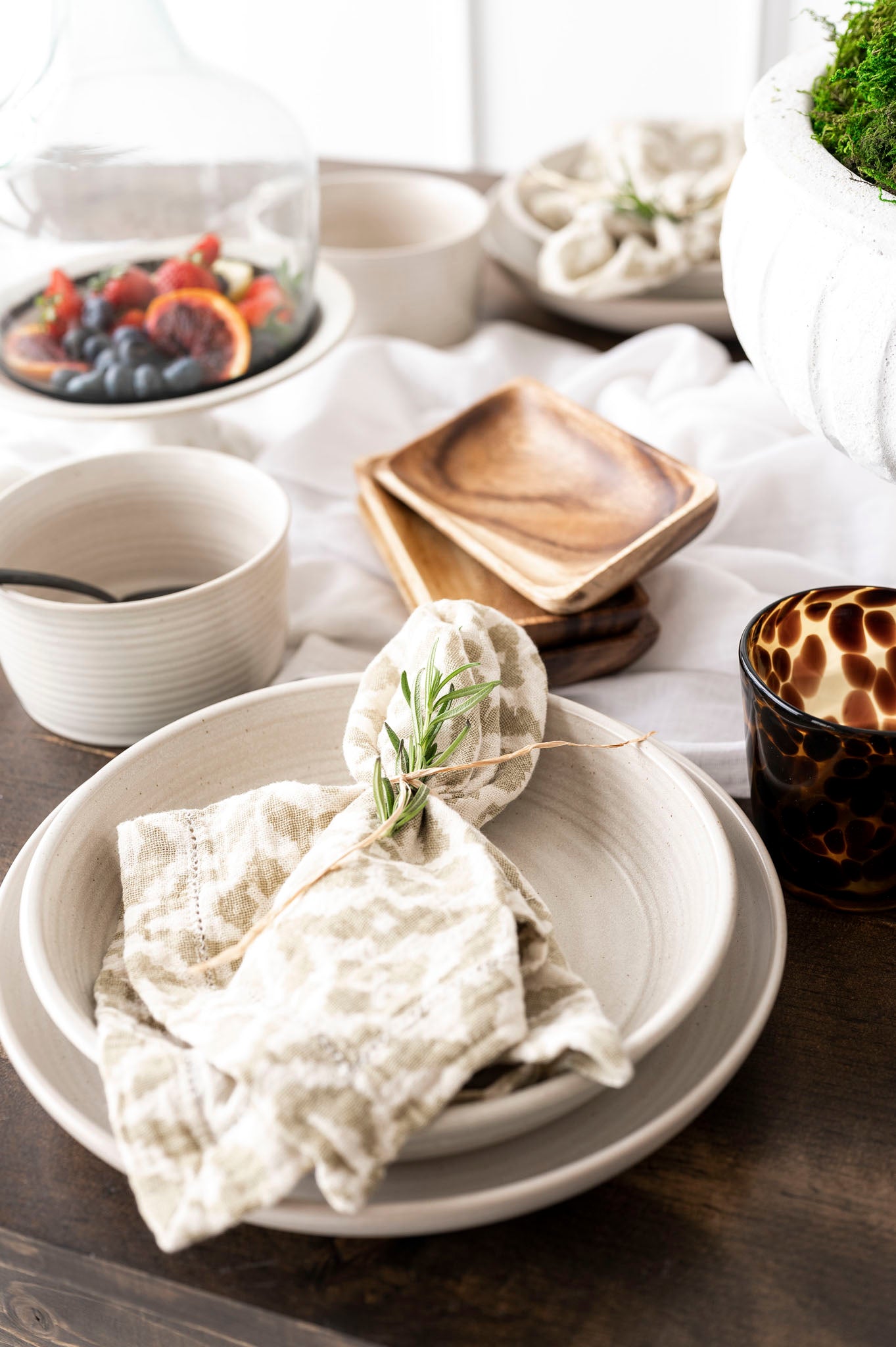 Shay Napkin on plate on wood table with white background