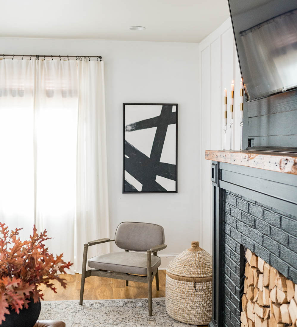Black and white art set with black frames on white wall in house
