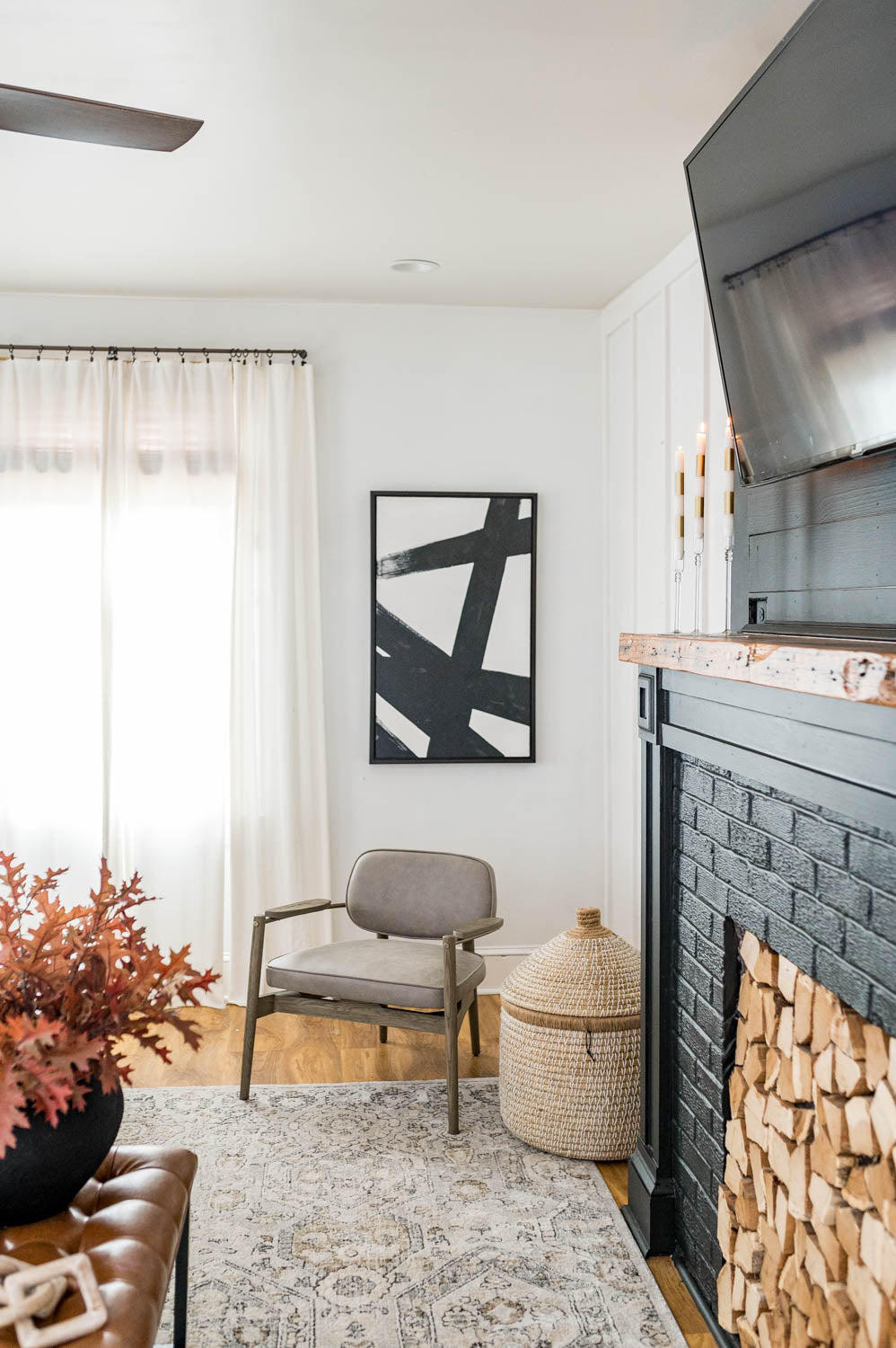 Black and white art set with black frames on white wall in house