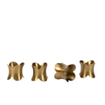 Scalloped brass napkin ring against white background.