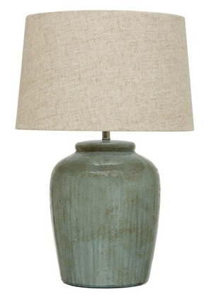 Aqua lamp with linen shade with white background.