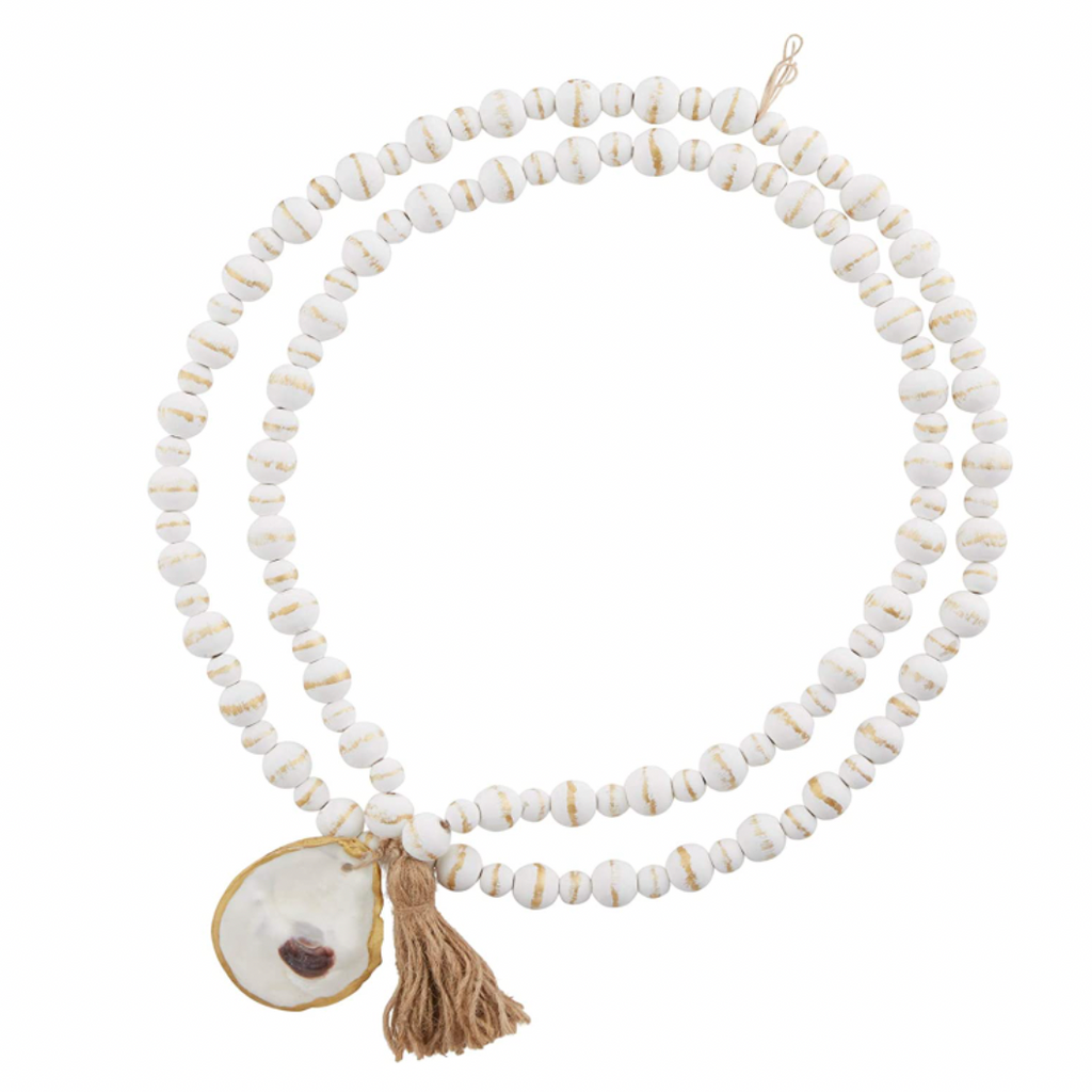white woods beads with oyster and jute tassel with white background