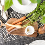 acacia wood board with round handles on summer styled table