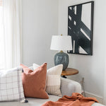 Black and white art set with black frames on white wall in house