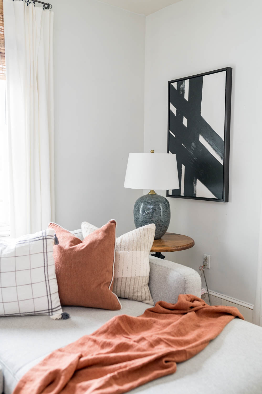 Black and white art set with black frames on white wall in house