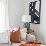 Black and white art set with black frames on white wall in house