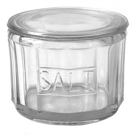 pressed glass salt cellar on white background