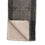 table runner with dot pattern folded back